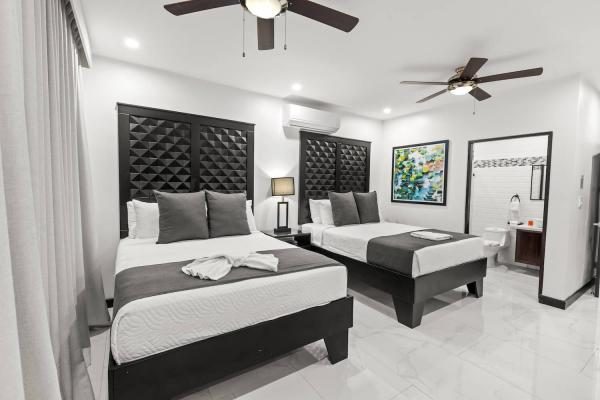 Double queen ensuite guest bedroom at Villa Roberto