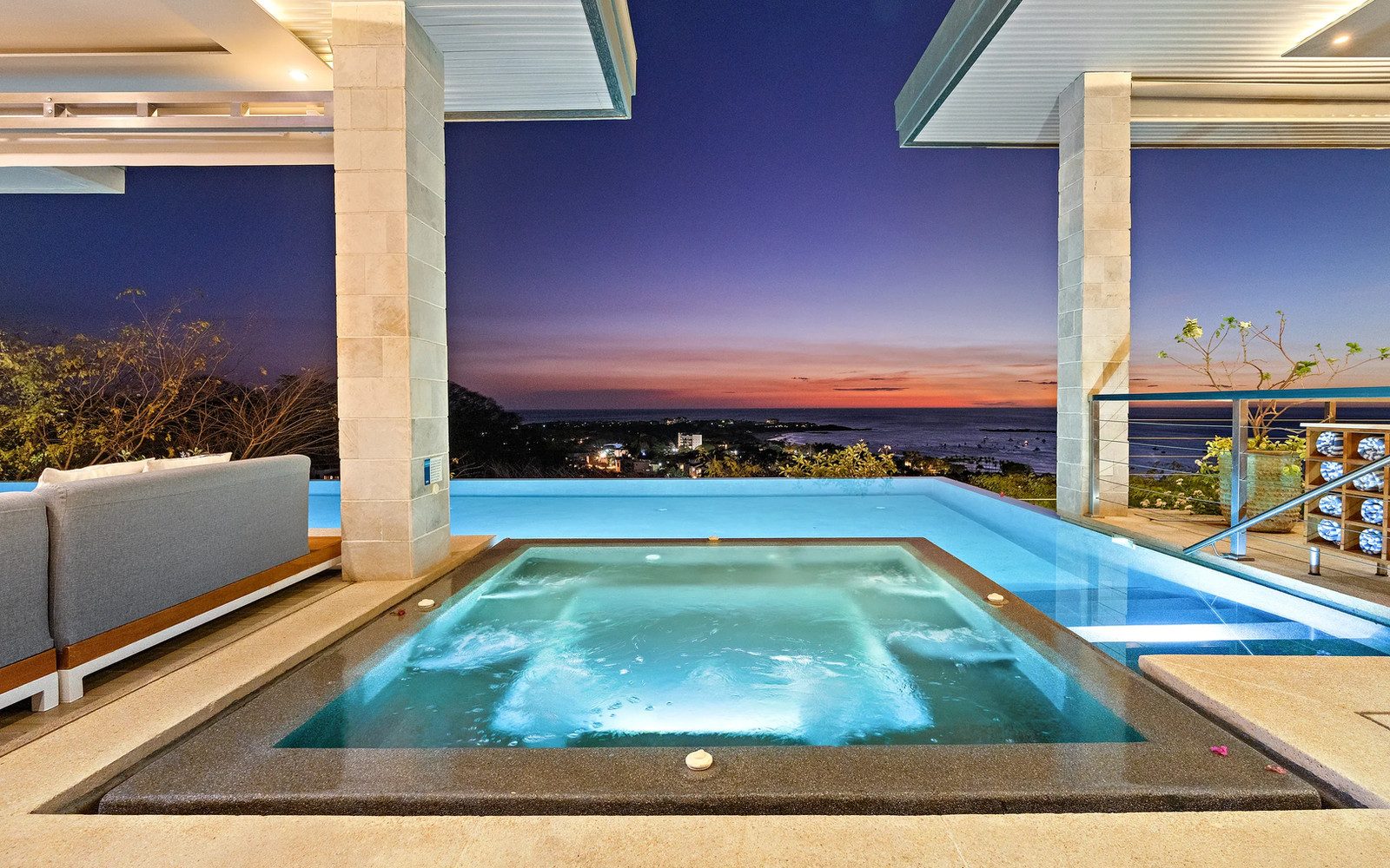 Infinity pool terrace at sunset at Villa Serenidad