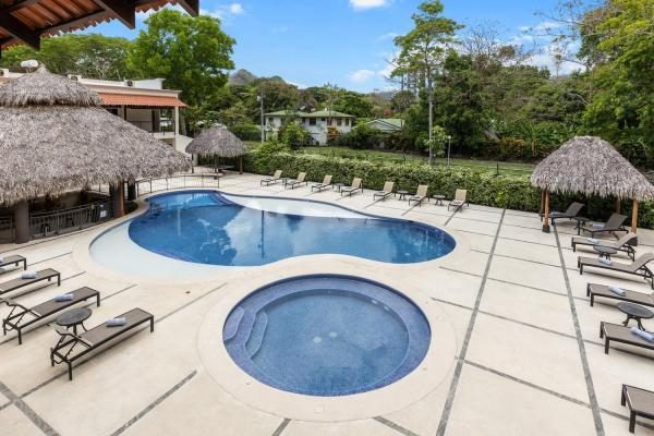 Pool, hot tub and palapa at Rancho de Sueños